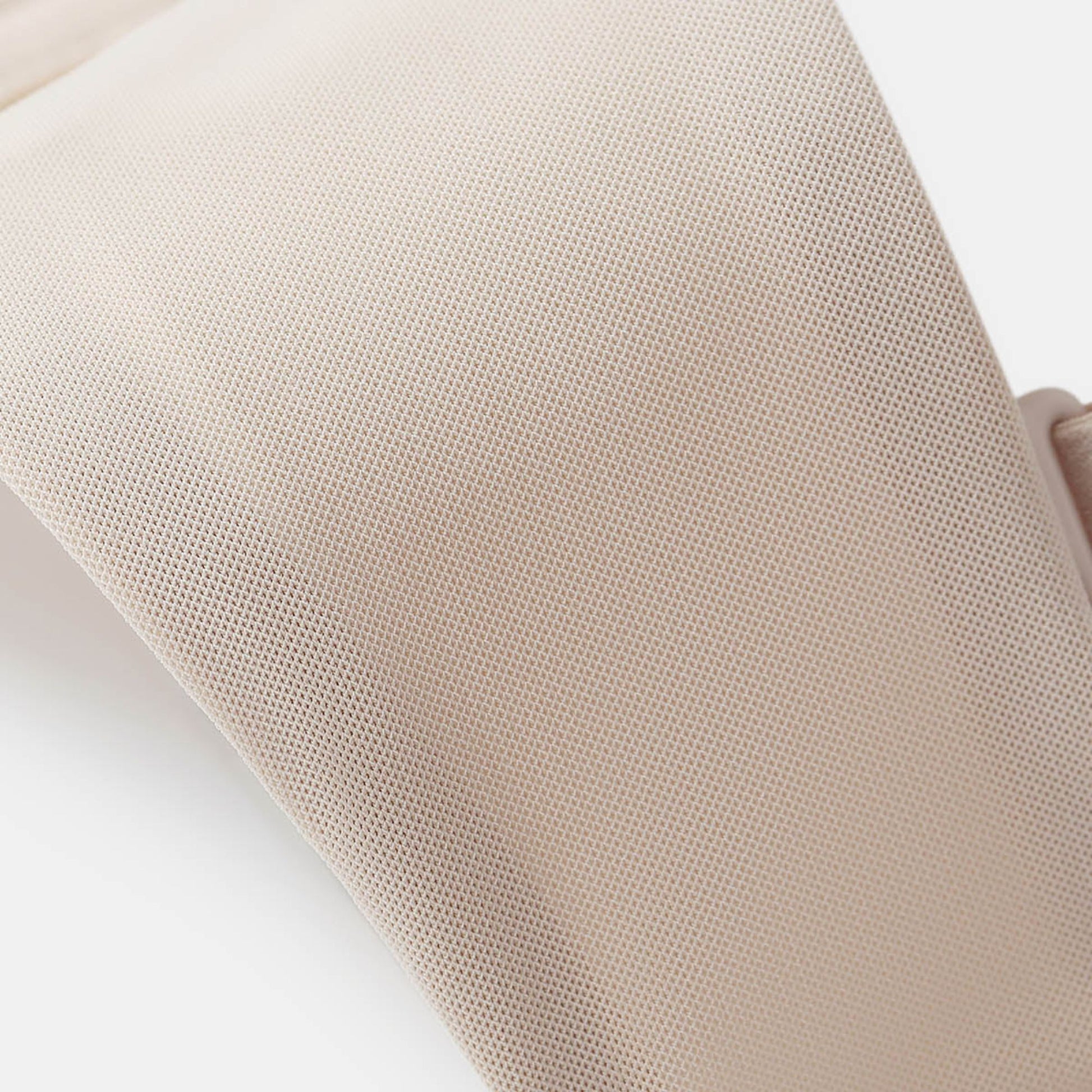Beige UBRAS Intense Convertible Bandeau. Soft mesh lining for breathable comfort.