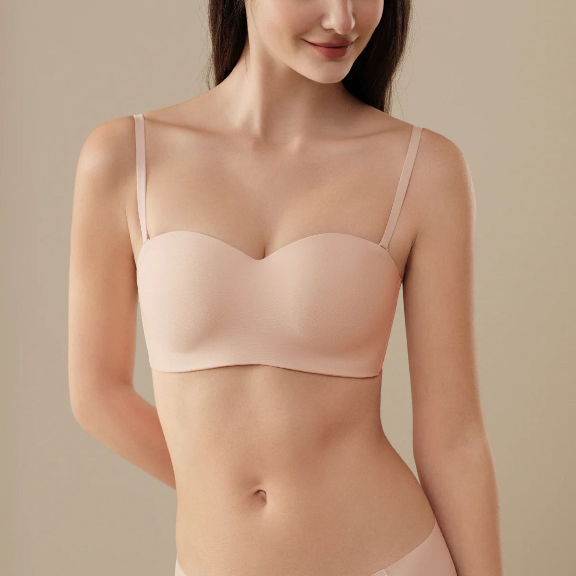 Woman wearing a pink UBRAS Intense Convertible Bandeau bra