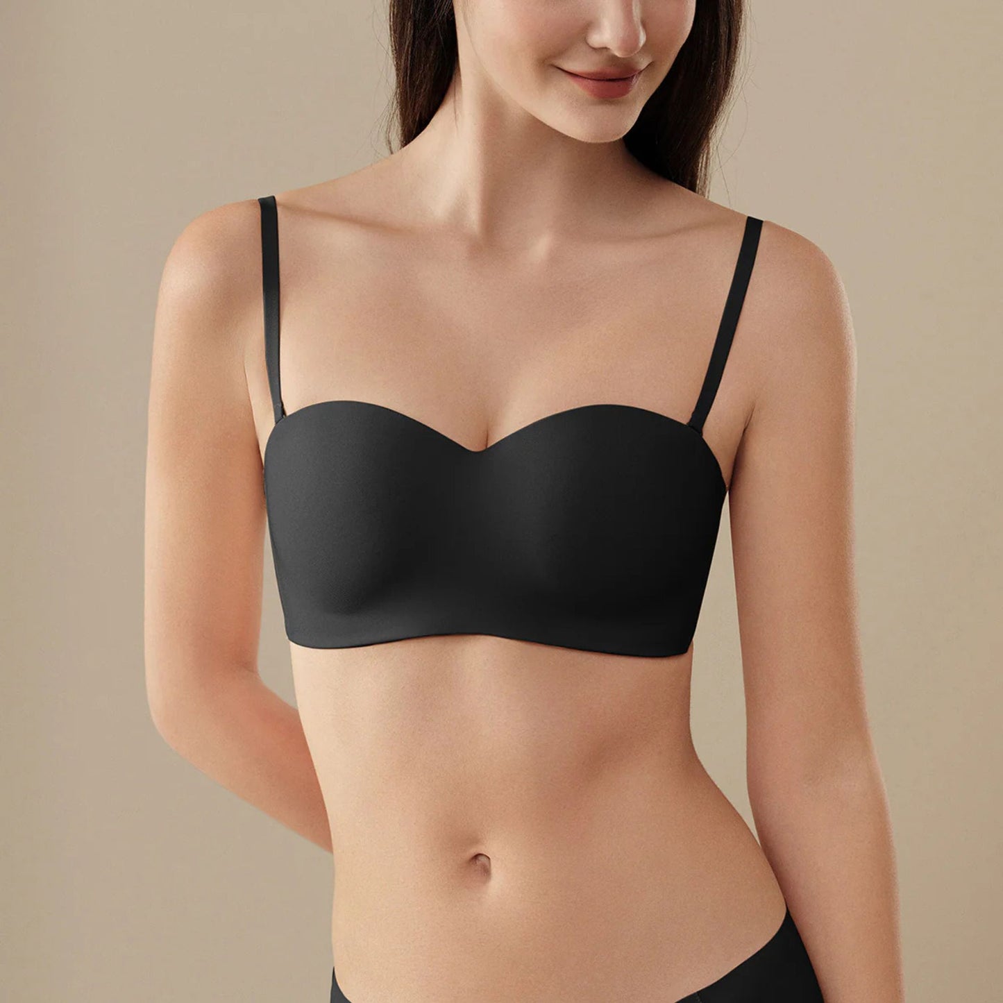 Women wearing a black UBRAS Intense Convertible Bandeau bra 